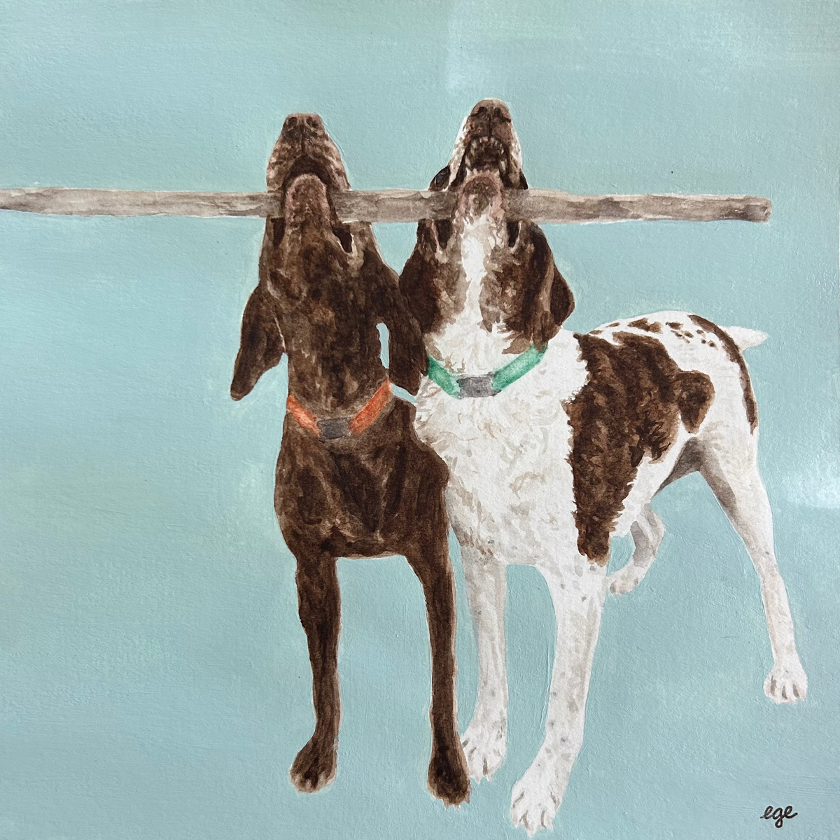 A square art print depicting two dogs howling at a stick, displayed on a rustic wooden surface. The print features a light blue background with a brown and white dog on the left and a white and brown dog on the right, both wearing collars.